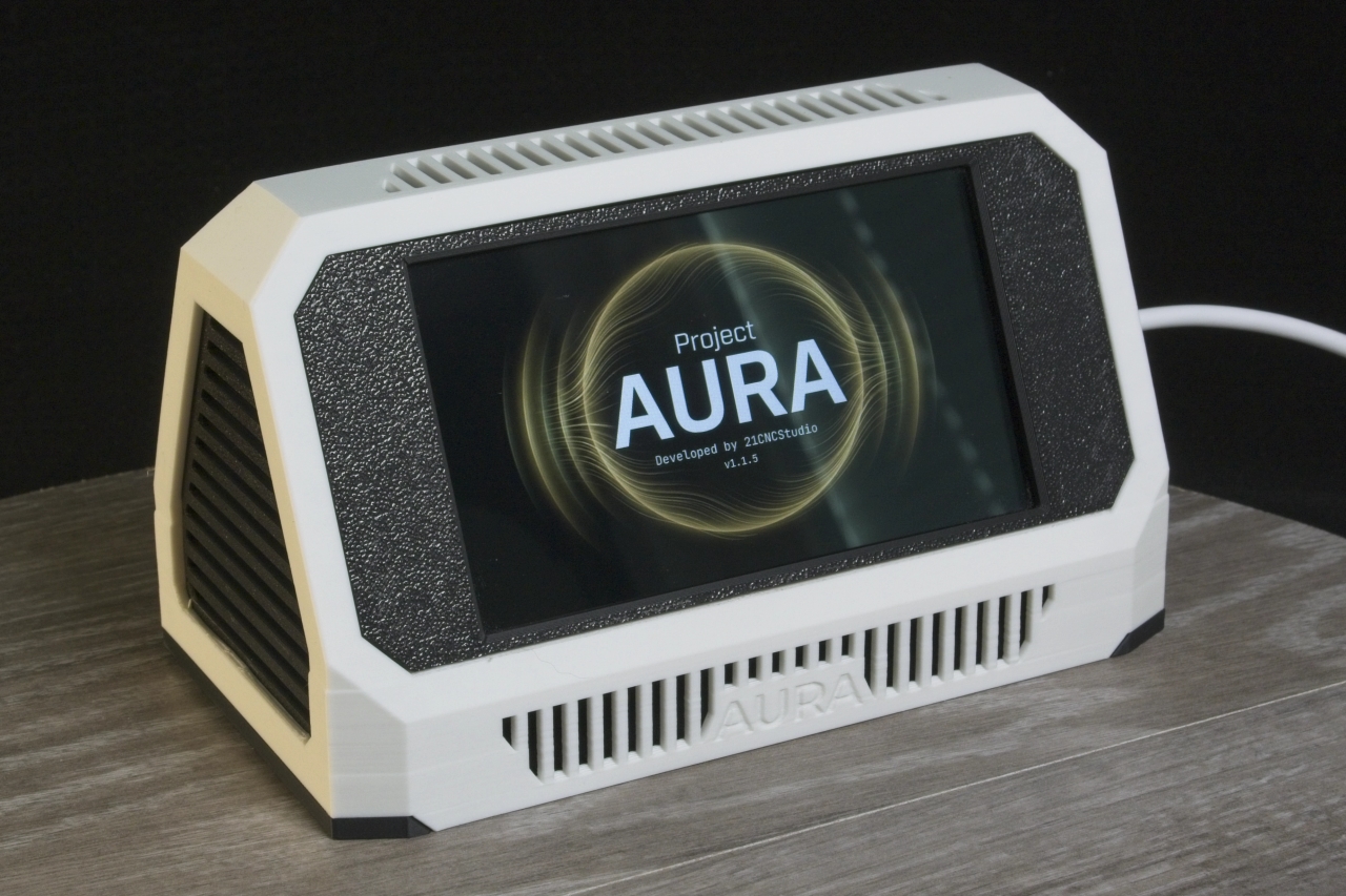 Aura original case (white) — front three-quarter view, Project Aura boot screen